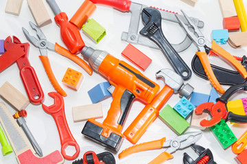 Toy tools and cubes on a light background. Toy for children