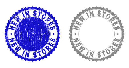 Grunge NEW IN STORES stamp seals isolated on a white background. Rosette seals with distress texture in blue and grey colors. Vector rubber stamp imitation of NEW IN STORES text inside round rosette.