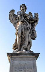 Angel with garment and dice. Sant'Angelo Bridge in the center of Rome