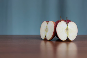 Ripe red apples on table close up
