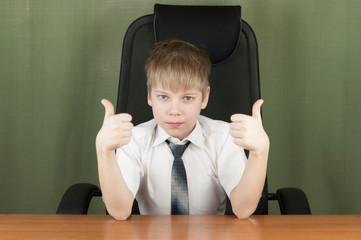 Young business boy. Little boss in office. Funny kids