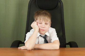 Fototapeta premium Young business boy. Little boss in office. Funny kids