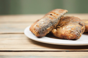 Fried fish crucian in plate