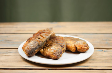 Fried fish crucian in plate