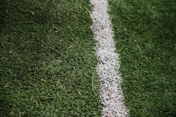 White markings on the lawn on the green field