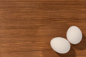 eggs on brown wooden background
