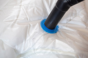 Space saver saving seal bag sucking air out﻿