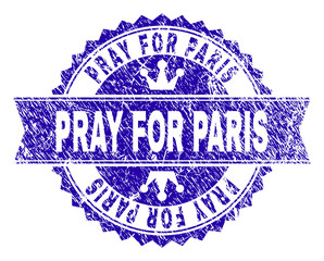 PRAY FOR PARIS rosette seal watermark with grunge texture. Designed with round rosette, ribbon and small crowns. Blue vector rubber print of PRAY FOR PARIS title with grunge texture.