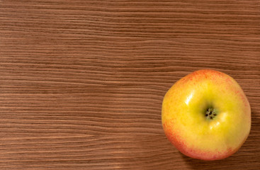 apples on a brown wooden background