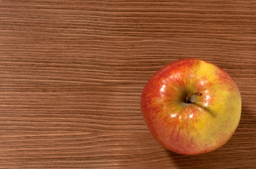apples on a brown wooden background