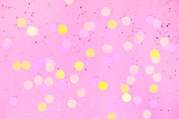 Fototapeta na wymiar Pink confetti background. Top view, flat lay. Vibrant and festive