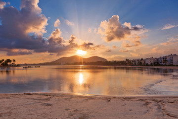 Beach of Alcudia town in sunset time