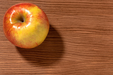 apples on a brown wooden background