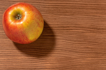 apples on a brown wooden background