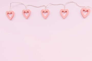 Valentine's Day decoration - heart shaped lights on a pink background
