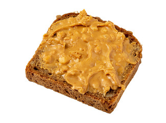 Piece of bread spread with peanut butter on white background. Isolated.