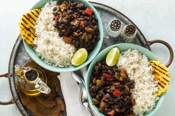 Cuban rice and black bean dish with grilled pineapple. Healthy Vegan Caribbean food for the whole family, party or restaurant menu