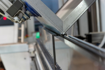 operator bending metal sheet by sheet bending machine