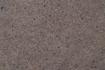 Texture of the surface of the fibreboard, macro.