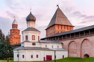 Fototapeta na wymiar Intercession church of the Mother of God, built in XVI century, by the tower and Kremlin walls, Veliky Novgorod, Russia