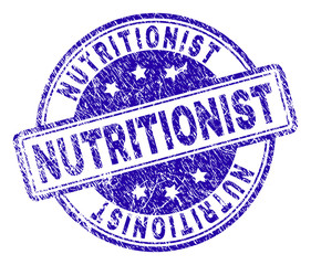 NUTRITIONIST stamp seal watermark with grunge texture. Designed with rounded rectangles and circles. Blue vector rubber print of NUTRITIONIST label with corroded texture.