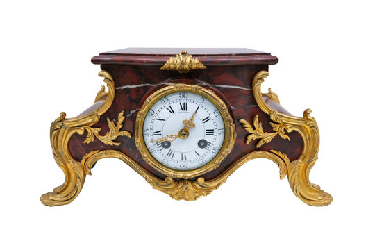 Antique mantel clock on a white background.