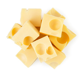 Heap of cheese cubes with holes on a white. The form of the top.