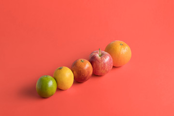 Fresh fruits on living coral background