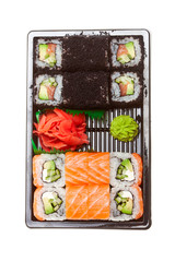Sushi Rolls Set, maki, california rolls, on black plate and on white background.