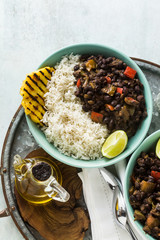 Cuban rice and black bean dish with grilled pineapple. Healthy Vegan Caribbean food for the whole family, party or restaurant menu