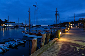 Fototapeta premium Beautiful view on the marina during a cloudy sunrise. Taken in Camden, Maine, United States.