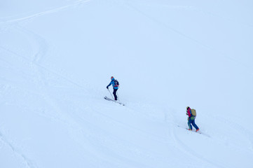 Fototapeta na wymiar Ski touring in harsh winter condition. Winter alpine landscape