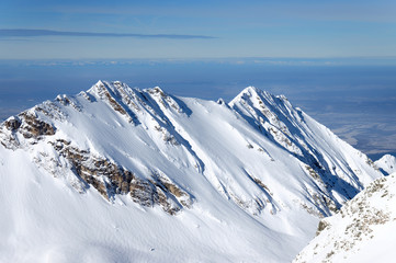 eautiful snow-capped mountains in the Transylvanian Alps, Romania. Alpine landscape in the mountains