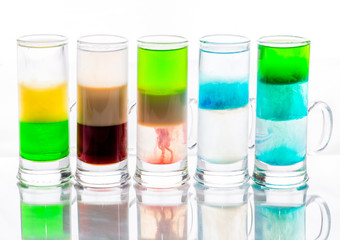 shots of colored layers of different alcohol
