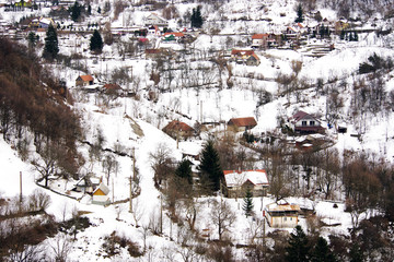 Winter landscape in the Carpathians Mountains. Snow covered small mountain village