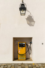 Retro Gas pump in front of white wall