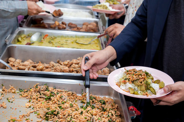 Food Buffet Catering Dining Eating Party Sharing Concept.people group catering buffet food indoor in luxury restaurant with meat colorful fruits and vegetables