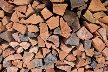 Triangular wooden logs stacked.