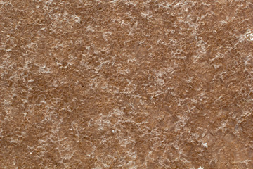 Natural white salt crystal texture on the sand, macro, close up. Salty lake shore background, Spain, Torrevieja.