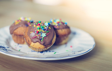 Homemade sweet tasty muffins with colourful decoration
