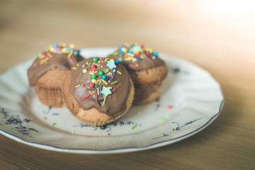 Homemade sweet tasty muffins with colourful decoration