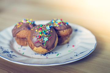 Homemade sweet tasty muffins with colourful decoration
