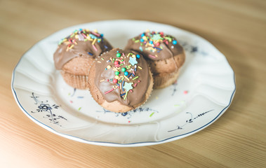 Homemade sweet tasty muffins with colourful decoration