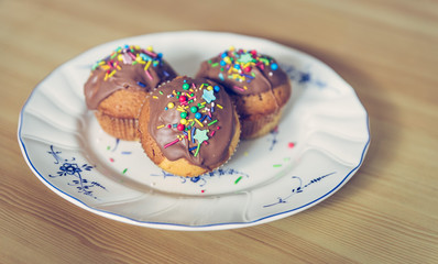 Homemade sweet tasty muffins with colourful decoration
