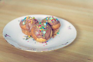 Homemade sweet tasty muffins with colourful decoration