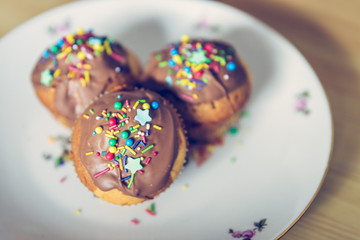 Homemade sweet tasty muffins with colourful decoration