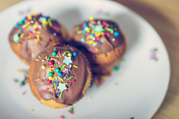 Homemade sweet tasty muffins with colourful decoration
