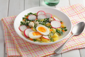 Spring soup with spinach, radish, and eggs
