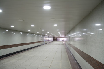 tunnel, underground pedestrian crossing at night, long concrete tunne