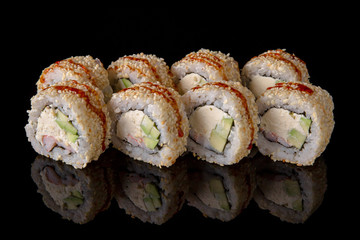 Sushi roll with shrimp, avocado, philadelphia on black background. Sushi menu. Japanese food.